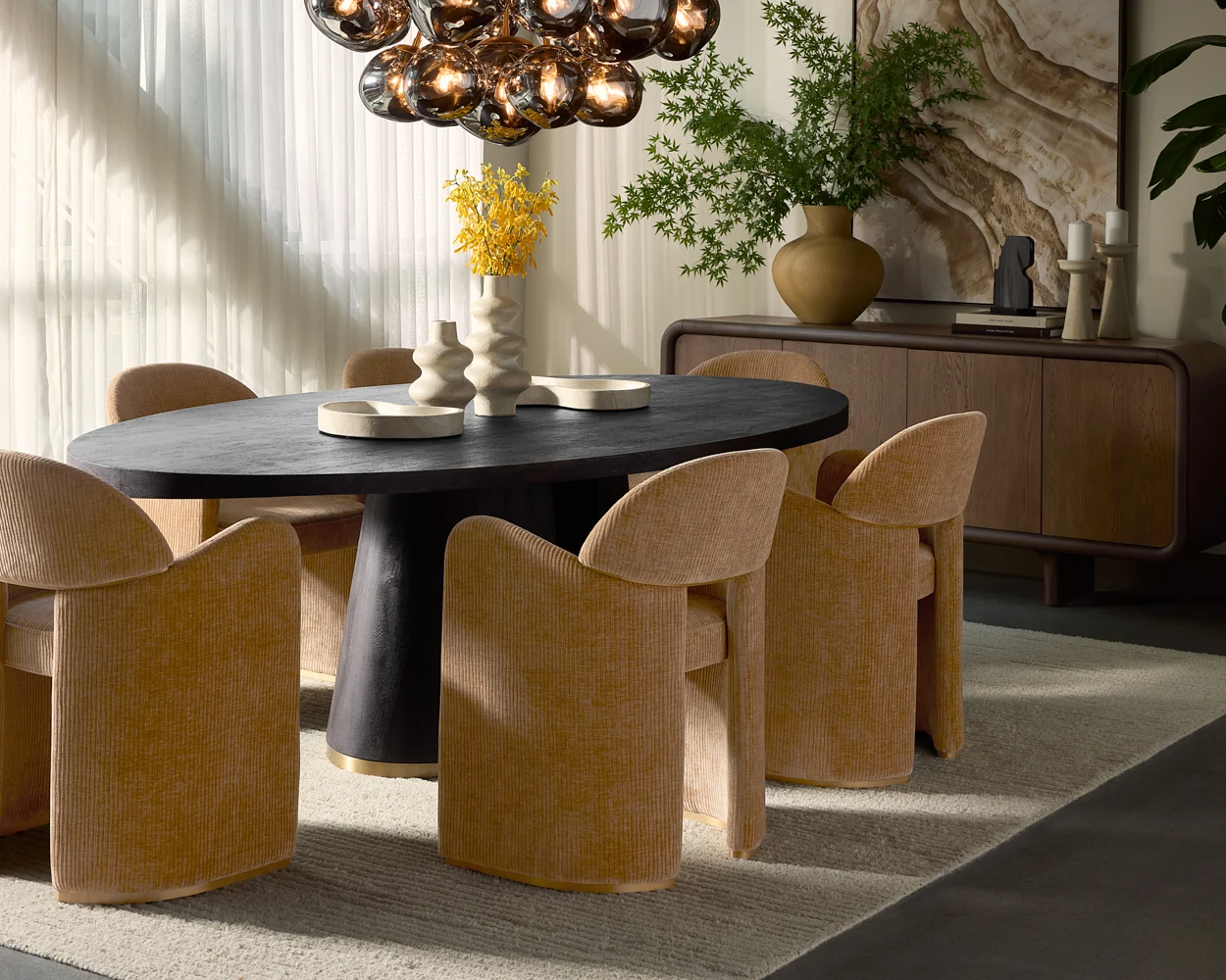 Close view of the flared pedestal base and its brushed gold trim line